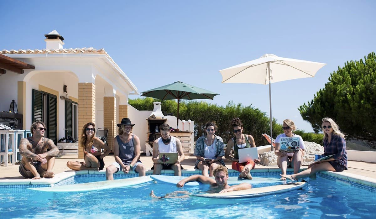 Coworksurf team working around a pool